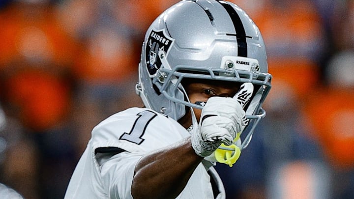 Nov 6, 2025; Denver, Colorado, USA; Las Vegas Raiders wide receiver Tre Tucker (1) gestures at the line of scrimmage in the fourth quarter against the Denver Broncos at Empower Field at Mile High. Mandatory Credit: Isaiah J. Downing-Imagn Images