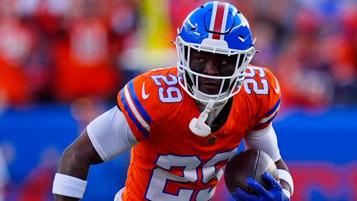 Jan 4, 2026; Denver, Colorado, USA; Denver Broncos cornerback Ja'quan McMillian (29) runs with the ball during the first half against the Los Angeles Chargers at Empower Field at Mile High.