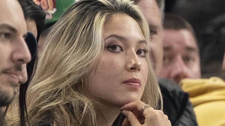 February 11, 2023; San Francisco, California, USA; Olympic gold medalist Eileen Gu sits courtside during the first quarter between the Golden State Warriors and the Los Angeles Lakers at Chase Center.