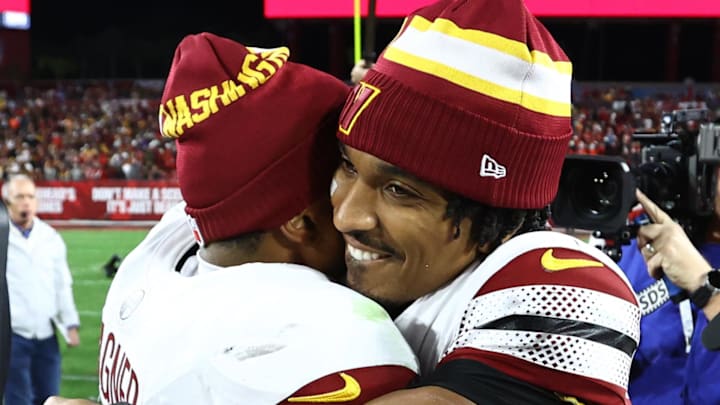 Jan 12, 2025; Tampa, Florida, USA; Washington Commanders quarterback Jayden Daniels (5) celebrates with linebacker Bobby Wagner (54) after winning a NFC wild card playoff against the Tampa Bay Buccaneers at Raymond James Stadium. Mandatory Credit: Kim Klement Neitzel-Imagn Images Jan 12, 2025; Tampa, Florida, USA; Washington Commanders quarterback Jayden Daniels (5) celebrates with linebacker Bobby Wagner (54) after winning a NFC wild card playoff against the Tampa Bay Buccaneers at Raymond James Stadium. Mandatory Credit: Kim Klement Neitzel-Imagn Images