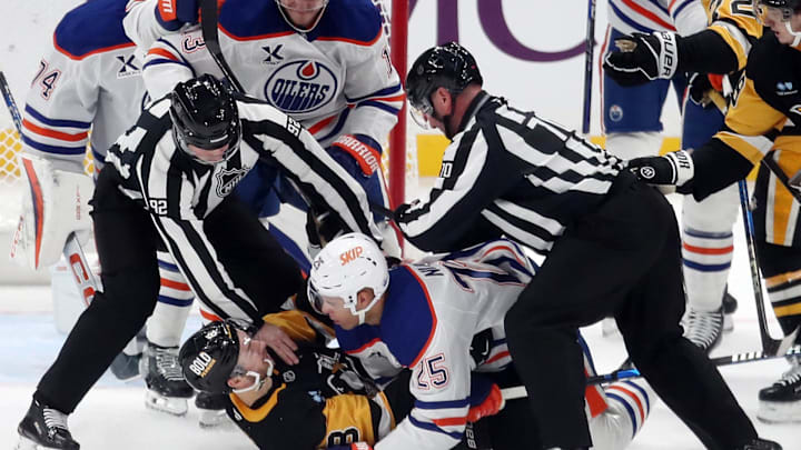 Edmonton Oilers defenseman Darnell Nurse (25) and Pittsburgh Penguins left wing Michael Bunting (8)