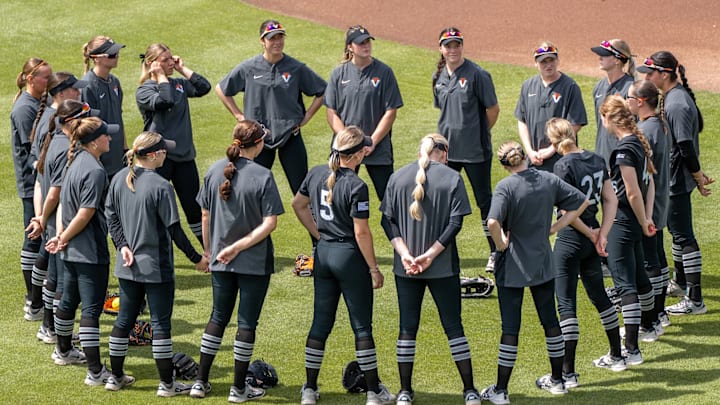 Virginia Tech Hokies gather around each other in a circle before their matchup