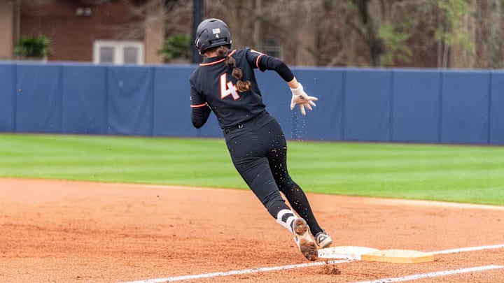 Michelle Chatfield (4) rounds first in the Jane B. Moore Invitational.