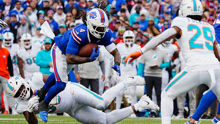 Bills James Cook avoids Miami's Calais Campbell's tackle during second half action at Highmark Stadium on Nov. 3, 2024. Bills James Cook avoids Miami's Calais Campbell's tackle during second half action at Highmark Stadium on Nov. 3, 2024.