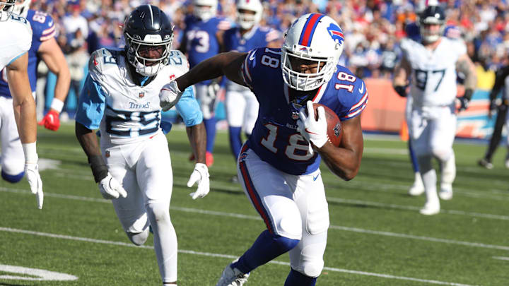Buffalo Bills wide receiver Amari Cooper runs toward the end zone with the ball against the Tennessee Titans. Buffalo Bills wide receiver Amari Cooper runs toward the end zone with the ball against the Tennessee Titans.