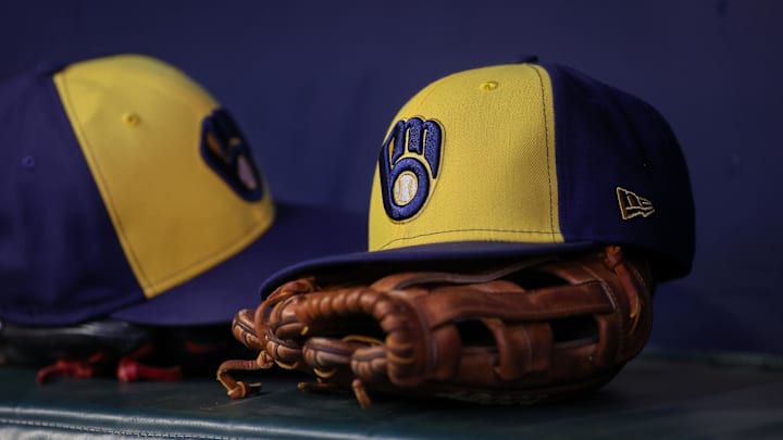 Jul 28, 2023; Atlanta, Georgia, USA; A detailed view of a Milwaukee Brewers hat and glove on the bench against the Atlanta Braves in the second inning at Truist Park. Mandatory Credit: Brett Davis-Imagn Images Jul 28, 2023; Atlanta, Georgia, USA; A detailed view of a Milwaukee Brewers hat and glove on the bench against the Atlanta Braves in the second inning at Truist Park. Mandatory Credit: Brett Davis-Imagn Images