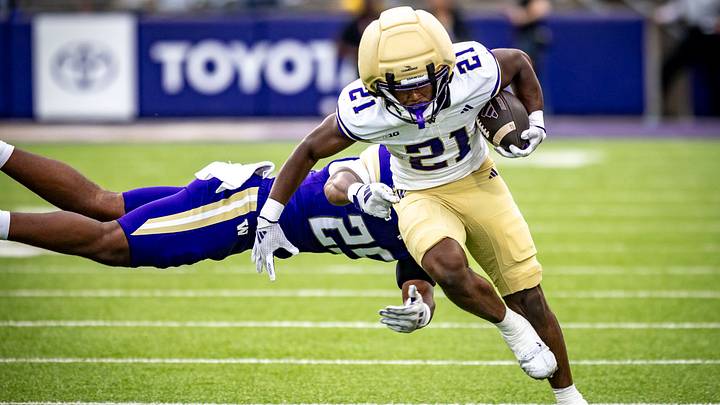 Quaid Carr breaks the tackle of linebacker Donovan Robinson. Quaid Carr breaks the tackle of linebacker Donovan Robinson.