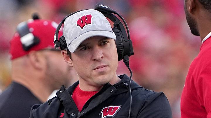 Nov 26, 2022; Madison, Wisconsin, USA; Wisconsin head coach Jim Leonhard, left, is shown during the first quarter of their game against Minnesota at Camp Randall Stadium. Mandatory Credit: Mark Hoffman-USA TODAY Sports Nov 26, 2022; Madison, Wisconsin, USA; Wisconsin head coach Jim Leonhard, left, is shown during the first quarter of their game against Minnesota at Camp Randall Stadium. Mandatory Credit: Mark Hoffman-USA TODAY Sports