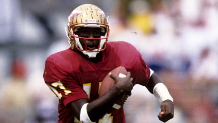 Oct 9, 1993; Tallahassee, FL, USA: FILE PHOTO; Florida State Seminoles quarterback Charlie Ward (17) runs with the ball against Miami at Doak Campbell Stadium. FSU defeated Miami 28-10 Mandatory Credit: Imagn Images