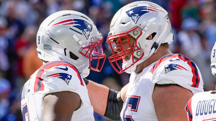 New England Patriots wide receiver Kayshon Boutte (9) celebrates his touchdown with center Garrett Bradbury (65) during the second quarter against the Tennessee Titans at Nissan Stadium in Nashville, Tenn., Sunday, Oct. 19, 2025.