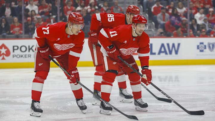 Feb 23, 2025; Detroit, Michigan, USA; Detroit Red Wings defenseman Simon Edvinsson (77) and right wing Vladimir Tarasenko (11) look on during a faceoff in the first period during the game against the Anaheim Ducks at Little Caesars Arena. Mandatory Credit: Brian Bradshaw Sevald-Imagn Images