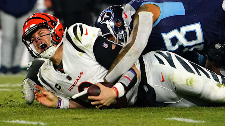 Cincinnati Bengals quarterback Joe Burrow (9) is sacked in the fourth quarter against the Titans.