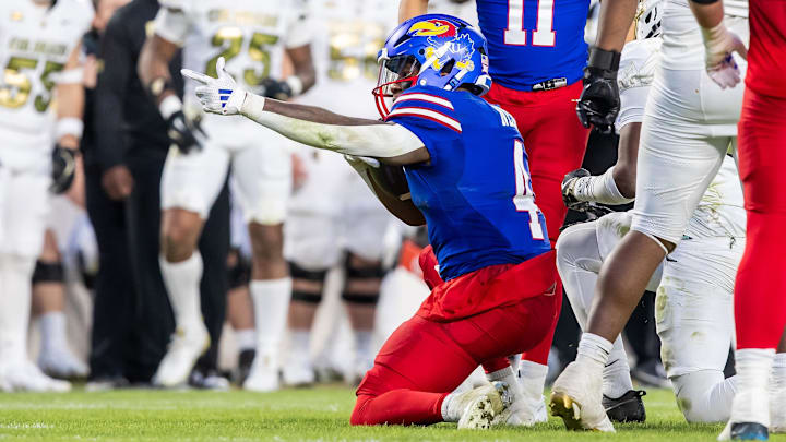 Nov 23, 2024; Kansas City, Missouri, USA;  Kansas running back Devin Neal (4) gestures for a first down during the 3rd quarter between the Kansas Jayhawks and the Colorado Buffaloes at GEHA Field at Arrowhead Stadium. Mandatory Credit: Nick Tre. Smith-Imagn Images