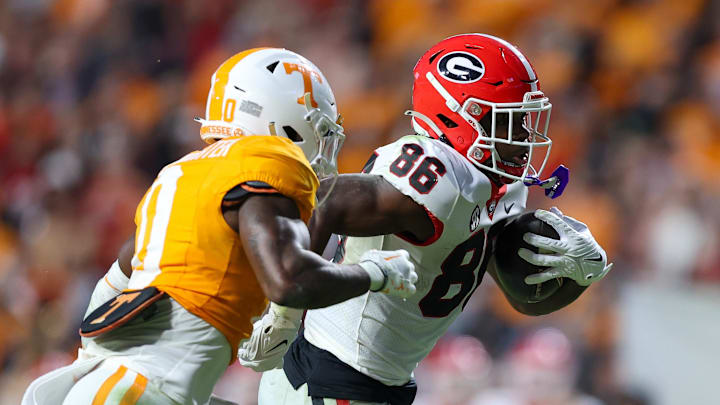Nov 18, 2023; Knoxville, Tennessee, USA; Georgia Bulldogs wide receiver Dillon Bell (86) runs the ball against the Tennessee Volunteers during the second half at Neyland Stadium. Mandatory Credit: Randy Sartin-Imagn Images Nov 18, 2023; Knoxville, Tennessee, USA; Georgia Bulldogs wide receiver Dillon Bell (86) runs the ball against the Tennessee Volunteers during the second half at Neyland Stadium. Mandatory Credit: Randy Sartin-Imagn Images