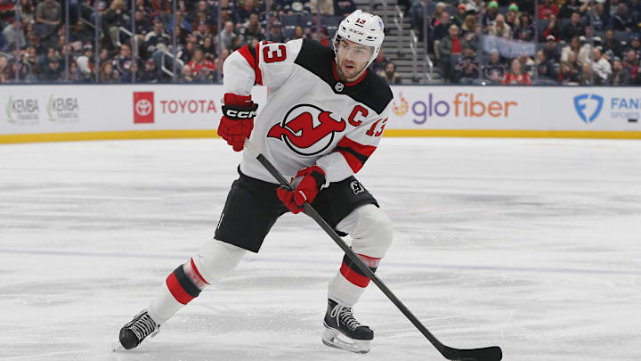 Dec 31, 2025; Columbus, Ohio, USA; New Jersey Devils center Nico Hischier (13) looks to pass against the Columbus Blue Jackets during the first period at Nationwide Arena. Mandatory Credit: Russell LaBounty-Imagn Images