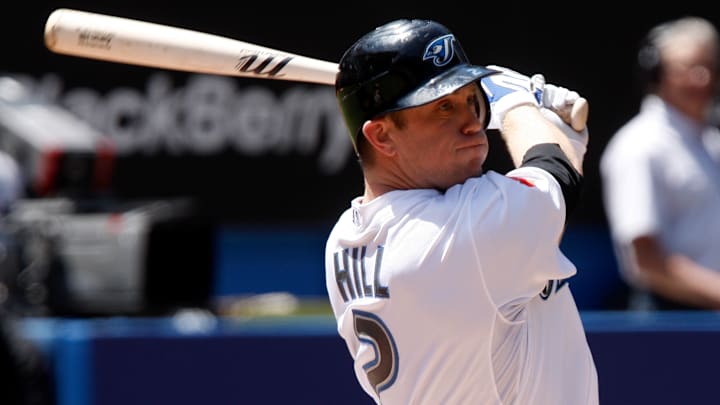 Blue Jays' infielder Aaron Hill takes a hard cut against the Yankees