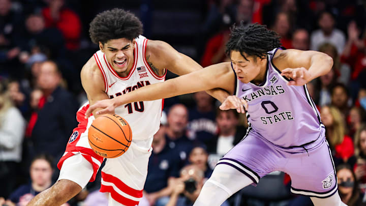 Jan 7, 2026; Tucson, Arizona, USA; Arizona Wildcats forward Koa Peat (10) dribbles the ball while Kansas State Wildcats wing Elias Rapieque attempts to take it during the second half of the game at McKale Memorial Center. Mandatory Credit: Aryanna Frank-Imagn Images