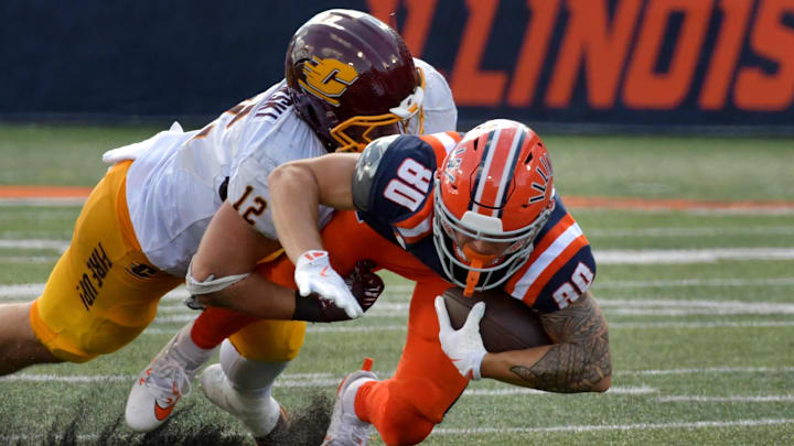 Sep 14, 2024; Champaign, Illinois, USA;  Illinois Fighting Illini wide receiver Hank Beatty (80) is brought down by Central Michigan Chippewas linebacker Jordan Kwiatkowski (12) during the second half at Memorial Stadium. Mandatory Credit: Ron Johnson-Imagn Images