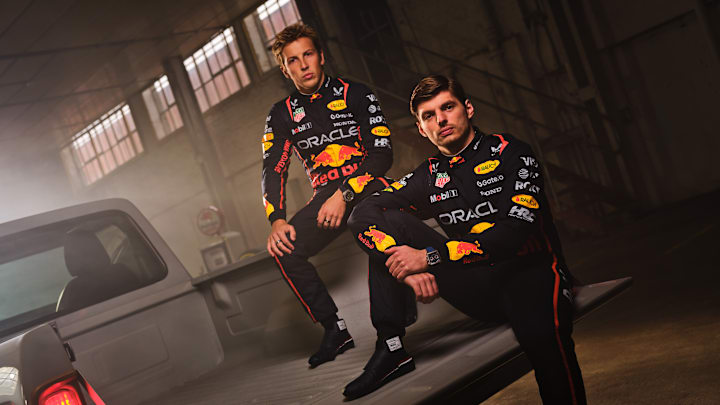 Oracle Red Bull Racing 2025 Season Kick Off - Max Verstappen and Liam Lawson pose on the back of a pick up, in the new 2025 Sparco Racesuit