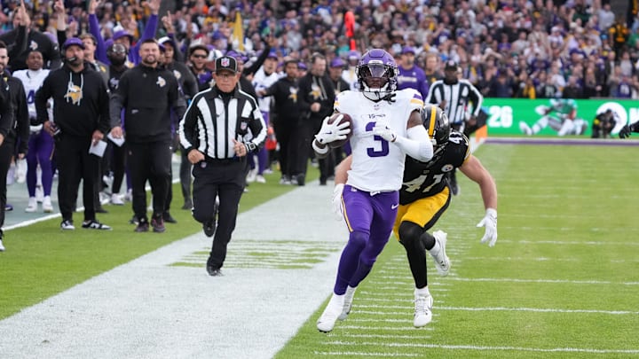 Sep 28, 2025; Dublin, Ireland; Minnesota Vikings wide receiver Jordan Addison (3) runs for a gain past Pittsburgh Steelers linebacker Payton Wilson (41) during the fourth quarter against the Pittsburgh Steelers during an NFL International Series game at Croke Park. 