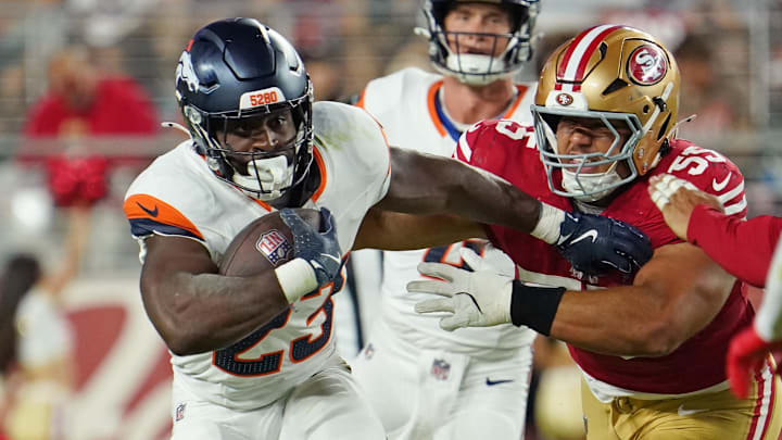 Aug 9, 2025; Santa Clara, California, USA;  Denver Broncos running back Audric Estime (23) rushes the ball past San Francisco 49ers defensive lineman Sebastian Valdez (55) in the fourth quarter at Levi's Stadium. Mandatory Credit: David Gonzales-Imagn Images