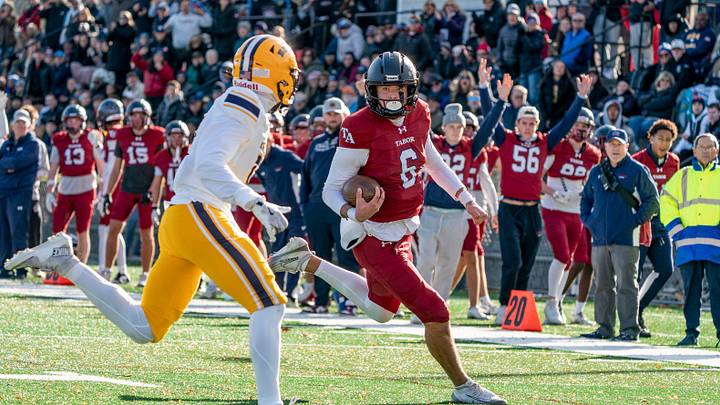 Tabor Academy's quarterback Peter Bourque runs in a touchdown.