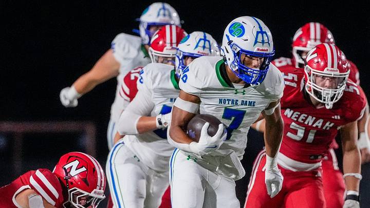 Green Bay Notre Dame's Kingston Allen (7) runs the ball against Neenah High School on Friday, Aug. 21, 2026, at Neenah High School in Neenah, Wisconsin. Notre Dame won the game in overtime, 56-53.
Tork Mason/Green Bay Press-Gazette