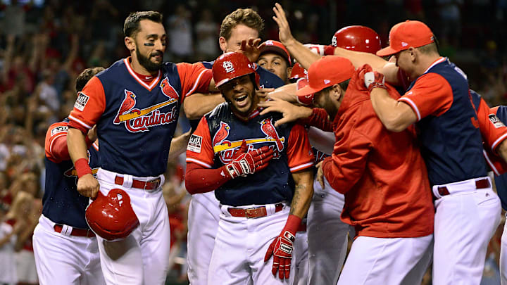 Aug 26, 2017; St. Louis, MO, USA; St. Louis Cardinals center fielder Tommy Pham (28) is congratulated by teammates after hitting a walk off two run home run off of Tampa Bay Rays relief pitcher Brad Boxberger (not pictured) during the ninth inning at Busch Stadium. Mandatory Credit: Jeff Curry-Imagn Images