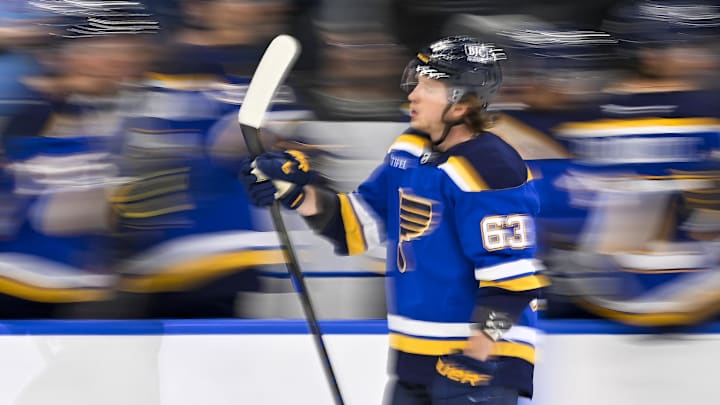 Mar 16, 2025; St. Louis, Missouri, USA;  St. Louis Blues left wing Jake Neighbours (63) is congratulated by teammates after scoring against the Anaheim Ducks during the third period at Enterprise Center. Mandatory Credit: Jeff Curry-Imagn Images
