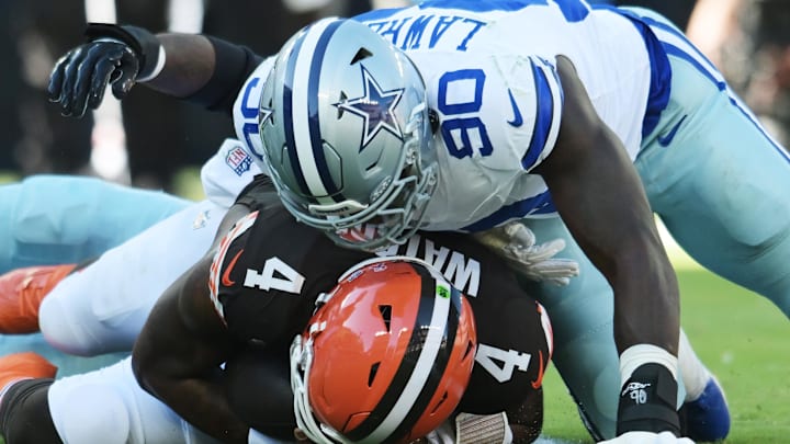 Dallas Cowboys defensive end DeMarcus Lawrence lies on Cleveland Browns quarterback Deshaun Watson. Dallas Cowboys defensive end DeMarcus Lawrence lies on Cleveland Browns quarterback Deshaun Watson.