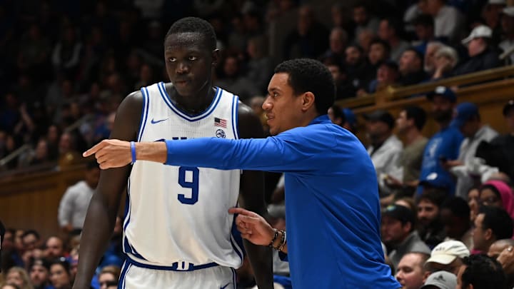 Dec 10, 2024; Durham, North Carolina, USA; Duke Blue Devils Director of player development, Justin Robinson (right) directs center Khaman Maluach (9) during the second half against the Incarnate Word Cardinals at Cameron Indoor Stadium. Dec 10, 2024; Durham, North Carolina, USA; Duke Blue Devils Director of player development, Justin Robinson (right) directs center Khaman Maluach (9) during the second half against the Incarnate Word Cardinals at Cameron Indoor Stadium.