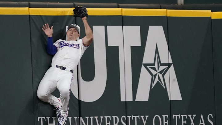 Jul 4, 2024; Arlington, Texas, USA; Texas Rangers outfielder Wyatt Langford (36) catches a fly ball during the second inning against the San Diego Padres at Globe Life Field. Mandatory Credit: Raymond Carlin III-USA TODAY Sports