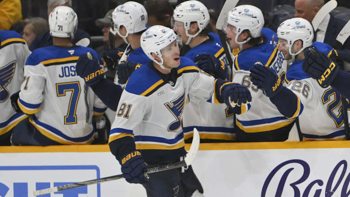 Mar 27, 2025; Nashville, Tennessee, USA;  St. Louis Blues center Dylan Holloway (81) against the Nashville Predators during the third period at Bridgestone Arena. Mandatory Credit: Steve Roberts-Imagn Images