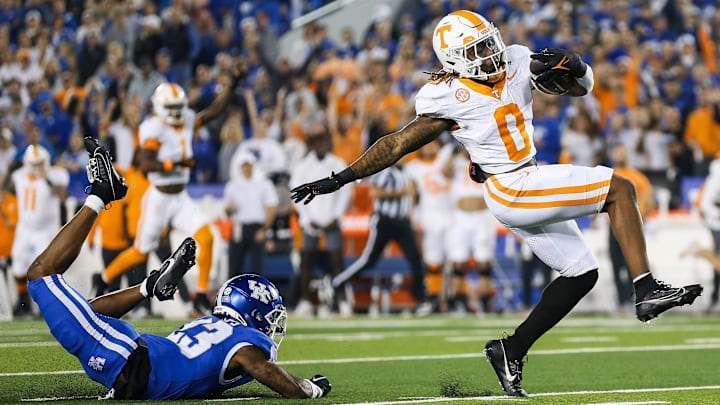 Tennessee Volunteers running back Jaylen Wright (0) dodges Kentucky Wildcats defensive back Andru Phillips (23) to strike first with a Volunteer touchdown early in the first quarter Saturday in Lexington. Oct. 28, 2023.