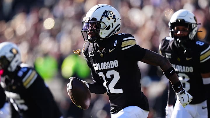 Nov 29, 2024; Boulder, Colorado, USA; Colorado Buffaloes cornerback Travis Hunter (12) following an interception in the first quarter against the Oklahoma State Cowboys  at Folsom Field. Mandatory Credit: Ron Chenoy-Imagn Images