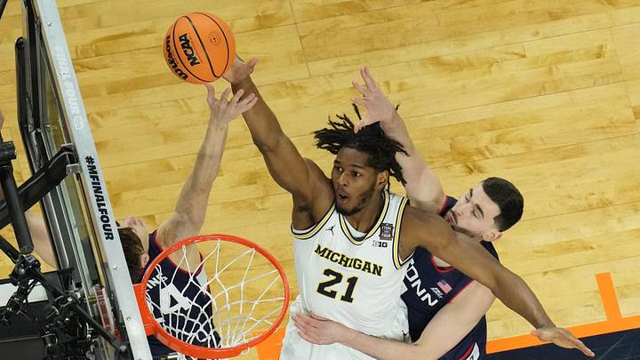 Apr 6, 2026; Indianapolis, IN, USA; Michigan Wolverines forward Morez Johnson Jr. (21) in action against the Connecticut Huskies during the national championship of the Final Four of the men's 2026 NCAA Tournament at Lucas Oil Stadium. Apr 6, 2026; Indianapolis, IN, USA; Michigan Wolverines forward Morez Johnson Jr. (21) in action against the Connecticut Huskies during the national championship of the Final Four of the men's 2026 NCAA Tournament at Lucas Oil Stadium.