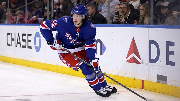 Mar 27, 2026; New York, New York, USA; New York Rangers defenseman Drew Fortescue (45) skates with the puck against the Chicago Blackhawks during the third period at Madison Square Garden. Mandatory Credit: Brad Penner-Imagn Images