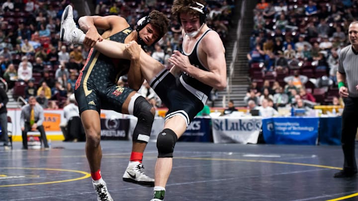 Bishop McCort's Melvin Miller takes down Faith Christians' Max Stein with six seconds left in the third period to claim gold at 152 pounds at the PIAA Class 2A Wrestling Championships at the Giant Center on March 9, 2024, in Hershey.