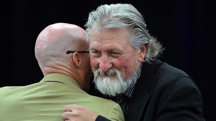 Former Zips basketball coach Bob Huggins, facing, hugs current coach John Groce after speaking during the Akron Basketball reunion and celebration at the University of Akron student union, Saturday, July 27, 2024, in Akron, Ohio.