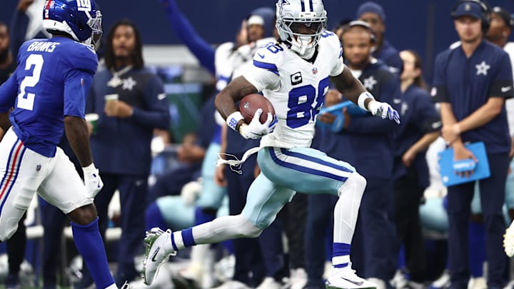 Sep 14, 2025; Arlington, Texas, USA; Dallas Cowboys wide receiver CeeDee Lamb (88) runs with the ball against the New York Giants during the second quarter.