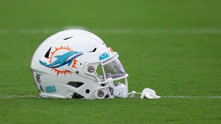 Aug 3, 2022; Miami Gardens, Florida, US; A general view of a Miami Dolphins helmet on the field during training camp at Baptist Health Training Complex. Mandatory Credit: Jasen Vinlove-Imagn Images