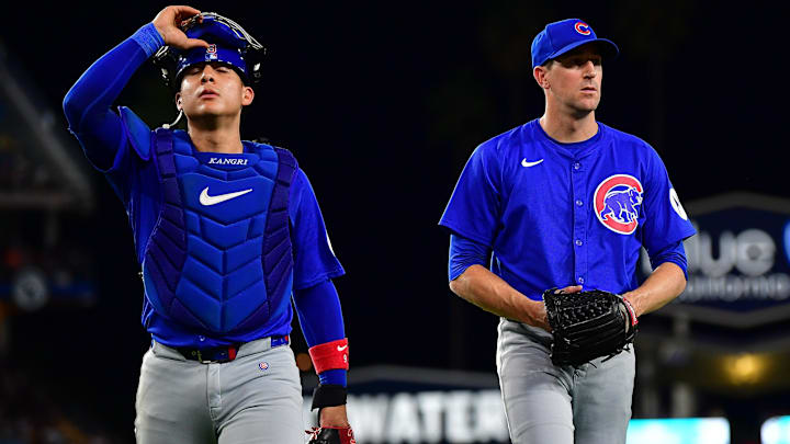 Sep 9, 2024; Los Angeles, California, USA; Chicago Cubs catcher Miguel Amaya (9) and pitcher Kyle Hendricks (28) return to the dugout following the third inning at Dodger Stadium.