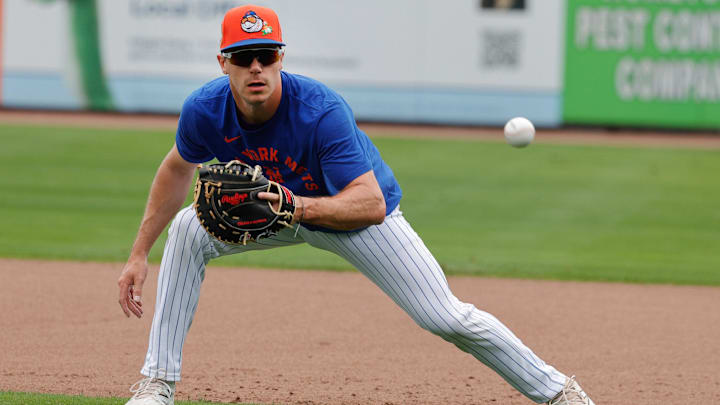 Feb 17, 2026; Port St. Lucie, FL, USA; New York Mets infielder Jared Young (29) fields a ground ball hopper during the New York Mets spring training workouts at Clover Park. Mandatory Credit: Reinhold Matay-Imagn Images Feb 17, 2026; Port St. Lucie, FL, USA; New York Mets infielder Jared Young (29) fields a ground ball hopper during the New York Mets spring training workouts at Clover Park. Mandatory Credit: Reinhold Matay-Imagn Images