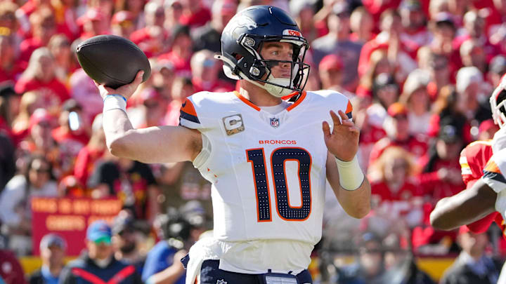 Nov 10, 2024; Kansas City, Missouri, USA; Denver Broncos quarterback Bo Nix (10) throws a pass against the Kansas City Chiefs during the first half at GEHA Field at Arrowhead Stadium. 