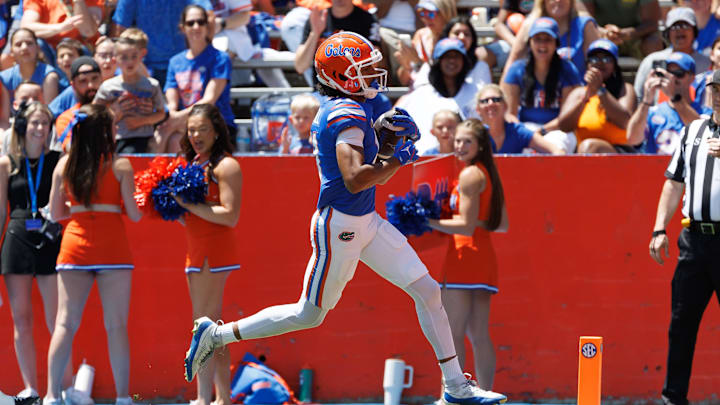 Apr 12, 2025; Gainesville, FL, USA; Florida Gators wide receiver Aidan Mizell (11) scores a touchdown during the first half at Ben Hill Griffin Stadium. Mandatory Credit: Matt Pendleton-Imagn Images