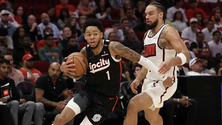 Nov 23, 2024; Houston, Texas, USA; Portland Trail Blazers guard Anfernee Simons (1) dribbles against Houston Rockets forward Dillon Brooks (9) in the second half at Toyota Center. Mandatory Credit: Thomas Shea-Imagn Images