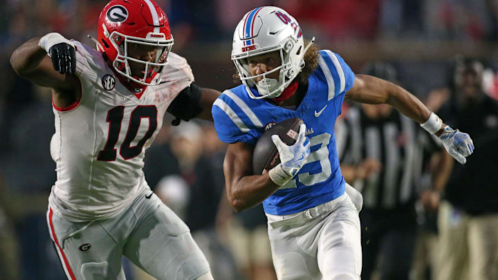 Nov 9, 2024; Oxford, Mississippi, USA; Mississippi Rebels wide receiver Cayden Lee (19) runs after a catch as Georgia Bulldogs linebacker Damon Wilson II (10) pursues during the second half at Vaught-Hemingway Stadium. Mandatory Credit: Petre Thomas-Imagn Images Nov 9, 2024; Oxford, Mississippi, USA; Mississippi Rebels wide receiver Cayden Lee (19) runs after a catch as Georgia Bulldogs linebacker Damon Wilson II (10) pursues during the second half at Vaught-Hemingway Stadium. Mandatory Credit: Petre Thomas-Imagn Images