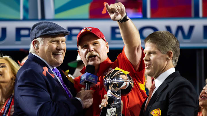 Feb 12, 2023; Glendale, Arizona, US; Fox host Terry Bradshaw (left) interviews Kansas City Chiefs head coach Andy Reid (center) as he celebrates with team owner Clark Hunt and the Vince Lombardi Trophy after winning Super Bowl LVII against the Philadelphia Eagles at State Farm Stadium. Mandatory Credit: Mark J. Rebilas-Imagn Images