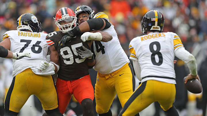 Cleveland Browns defensive end Myles Garrett (95) tries to get past Pittsburgh Steelers offensive tackle Troy Fautanu (76) and guard Spencer Anderson (74) during the second half of an NFL football game at Huntington Bank Field, Dec. 28, 2025, in Cleveland, Ohio.