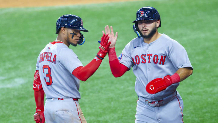 Arlington, Texas, USA; Boston Red Sox right fielder Wilyer Abreu (52) celebrates with Boston Red Sox center fielder Ceddanne Rafaela (3) after scoring during the sixth inning against the Texas Rangers at Globe Life Field.